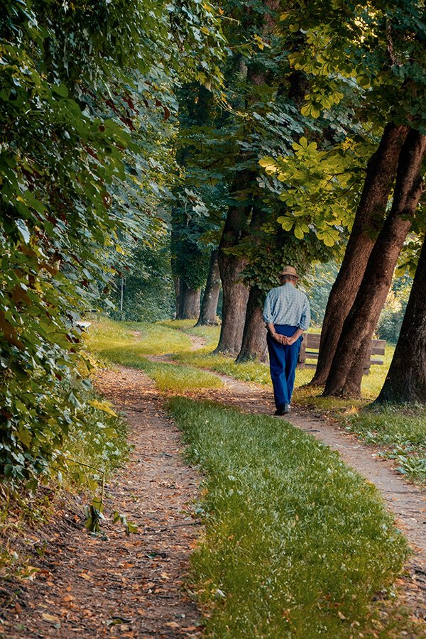 Man walking on grassy path