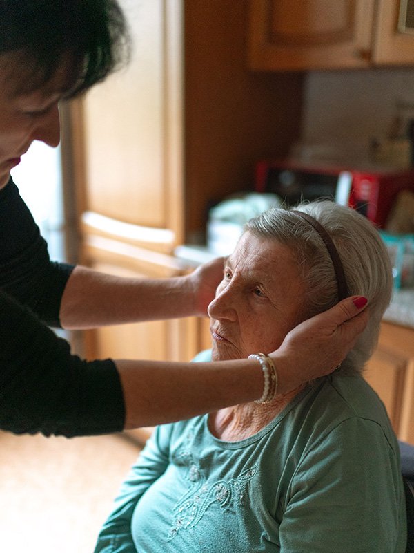 Elderly woman with caregiver